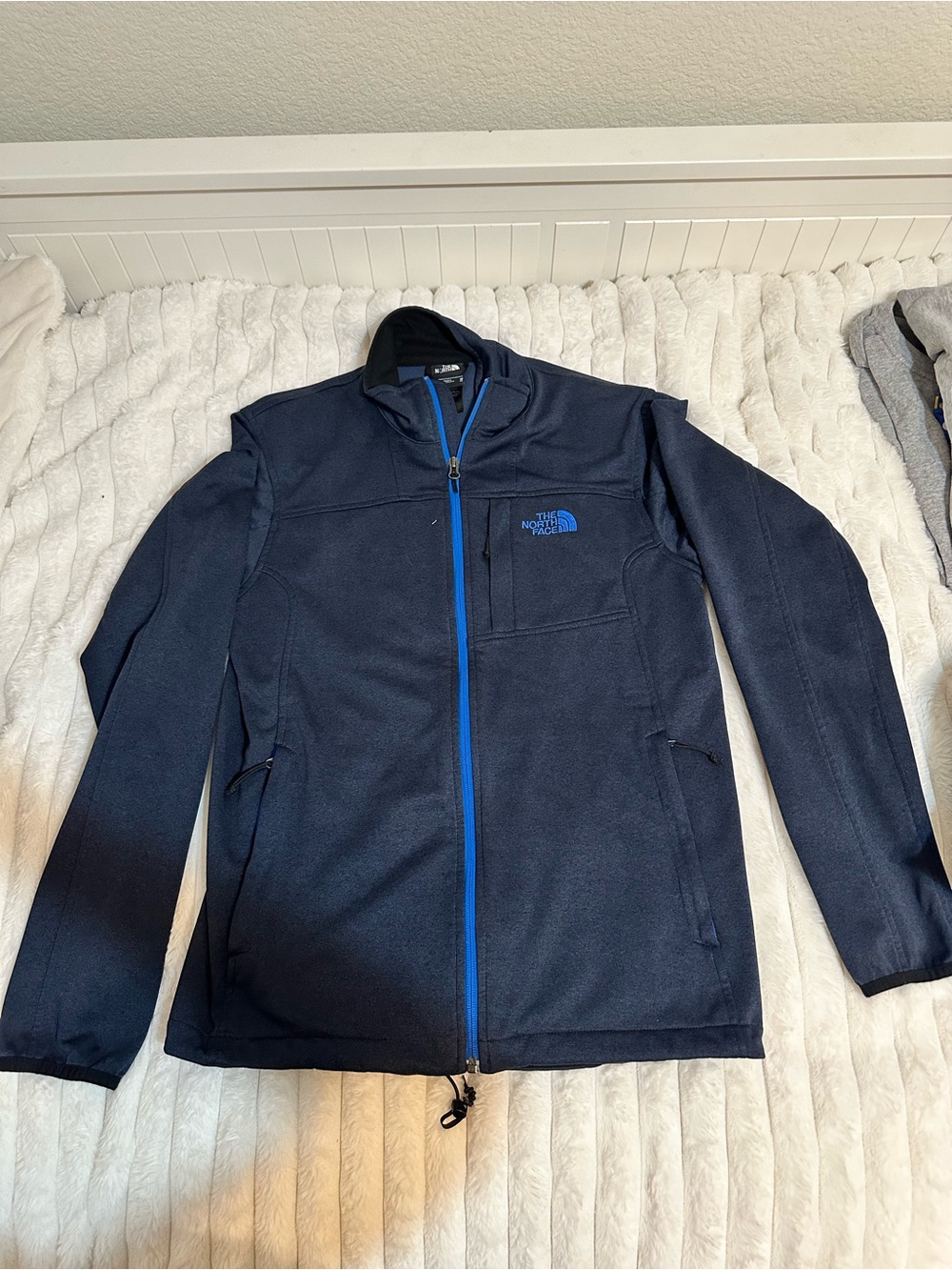 The North Face Men's Navy Jacket with Blue Zipper